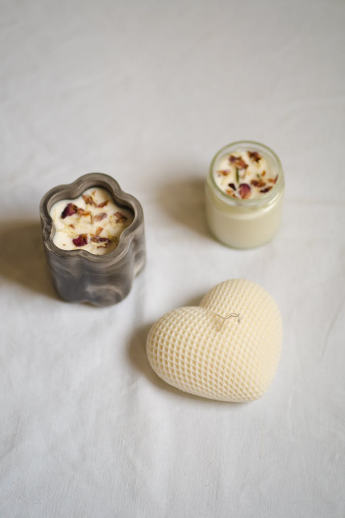 A minimalist still life featuring artisan candles in unique shapes, creating a serene and elegant atmosphere.